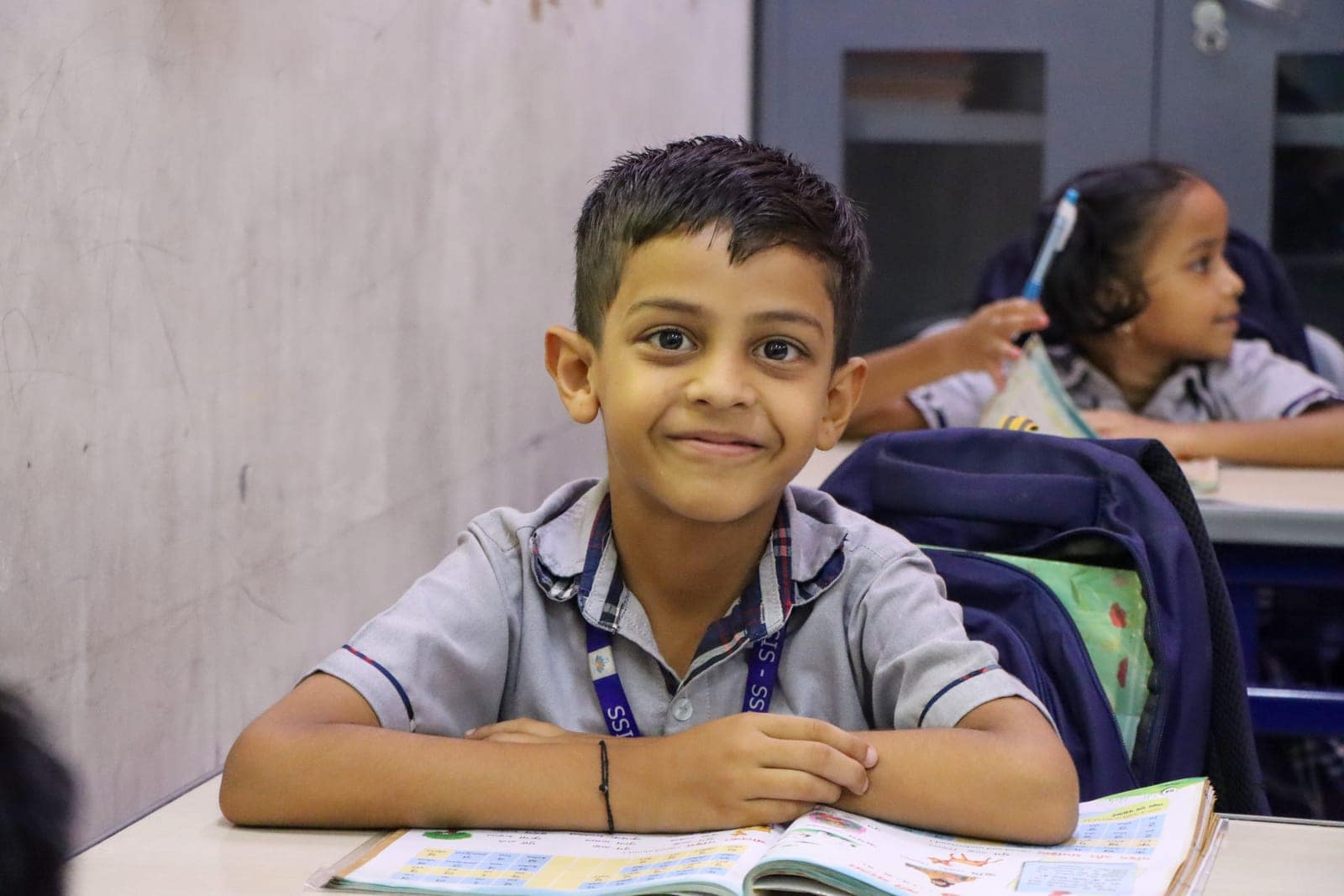 Front bench smile in a classroom at Sri Sharada International School
