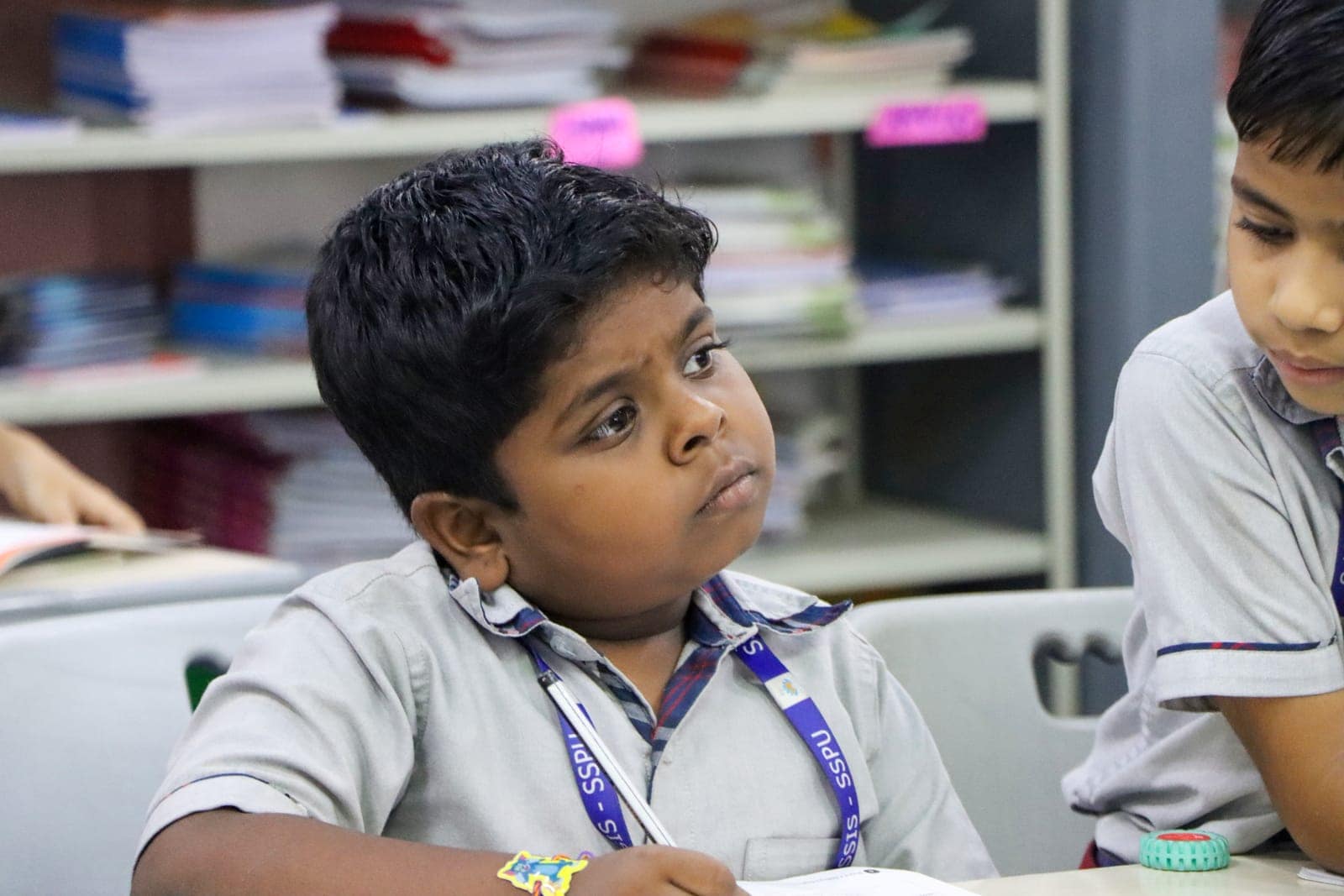 Listening closely in a classroom at Sri Sharada International School