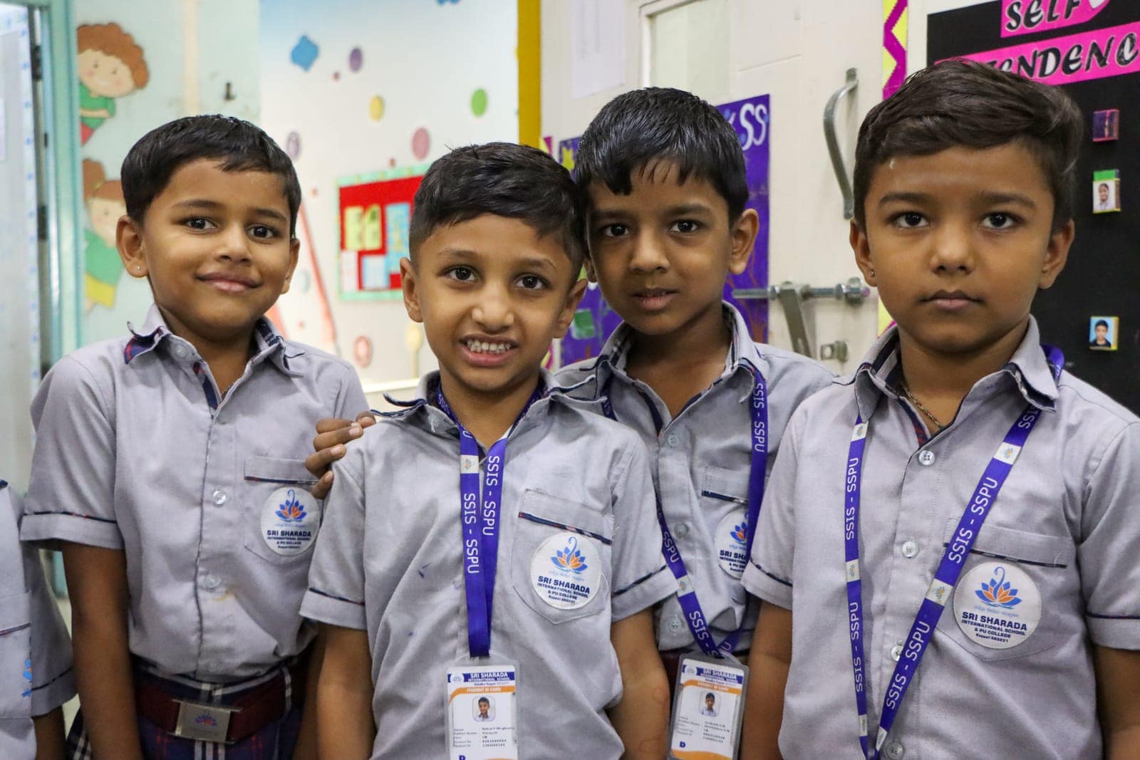 Proud four in a classroom at Sri Sharada International School