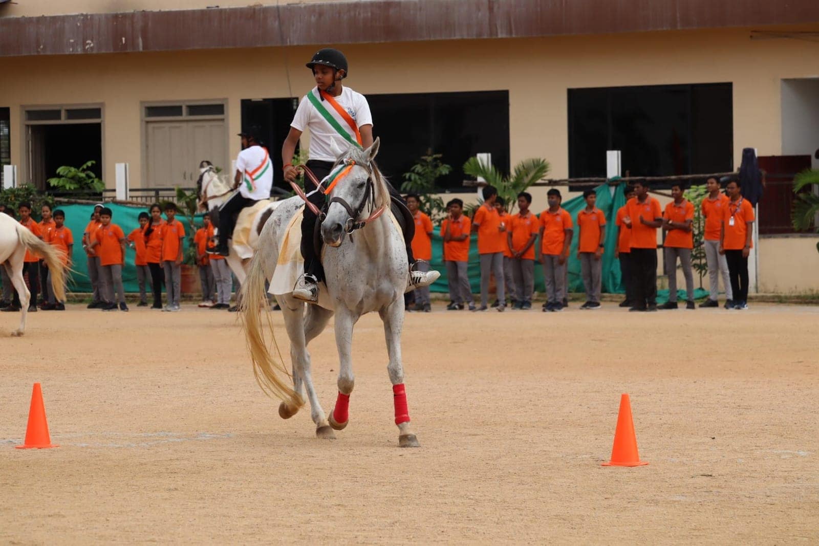 Students playing horse display at Sri Sharada International School
