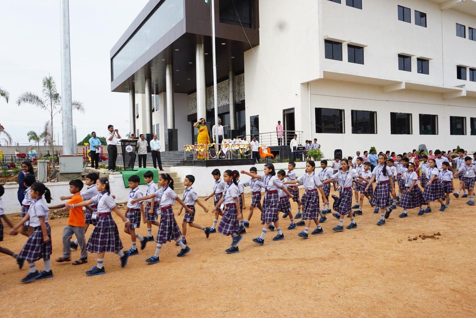 Students playing pt march at Sri Sharada International School