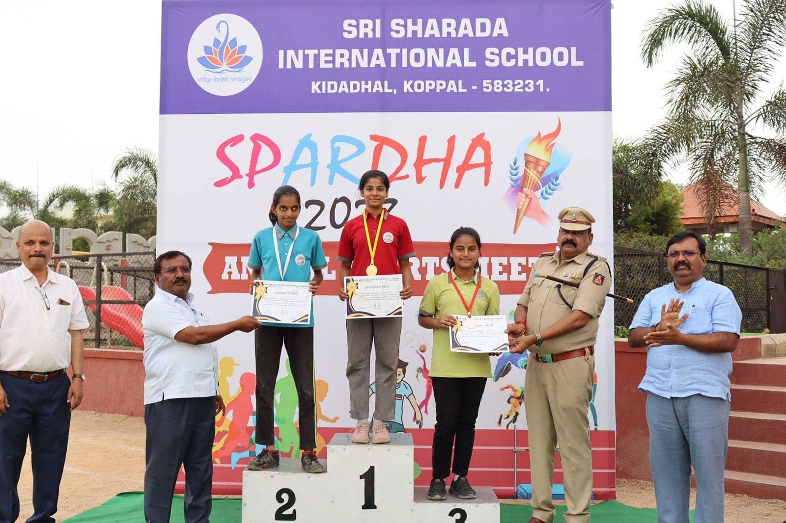Students playing spardha podium at Sri Sharada International School