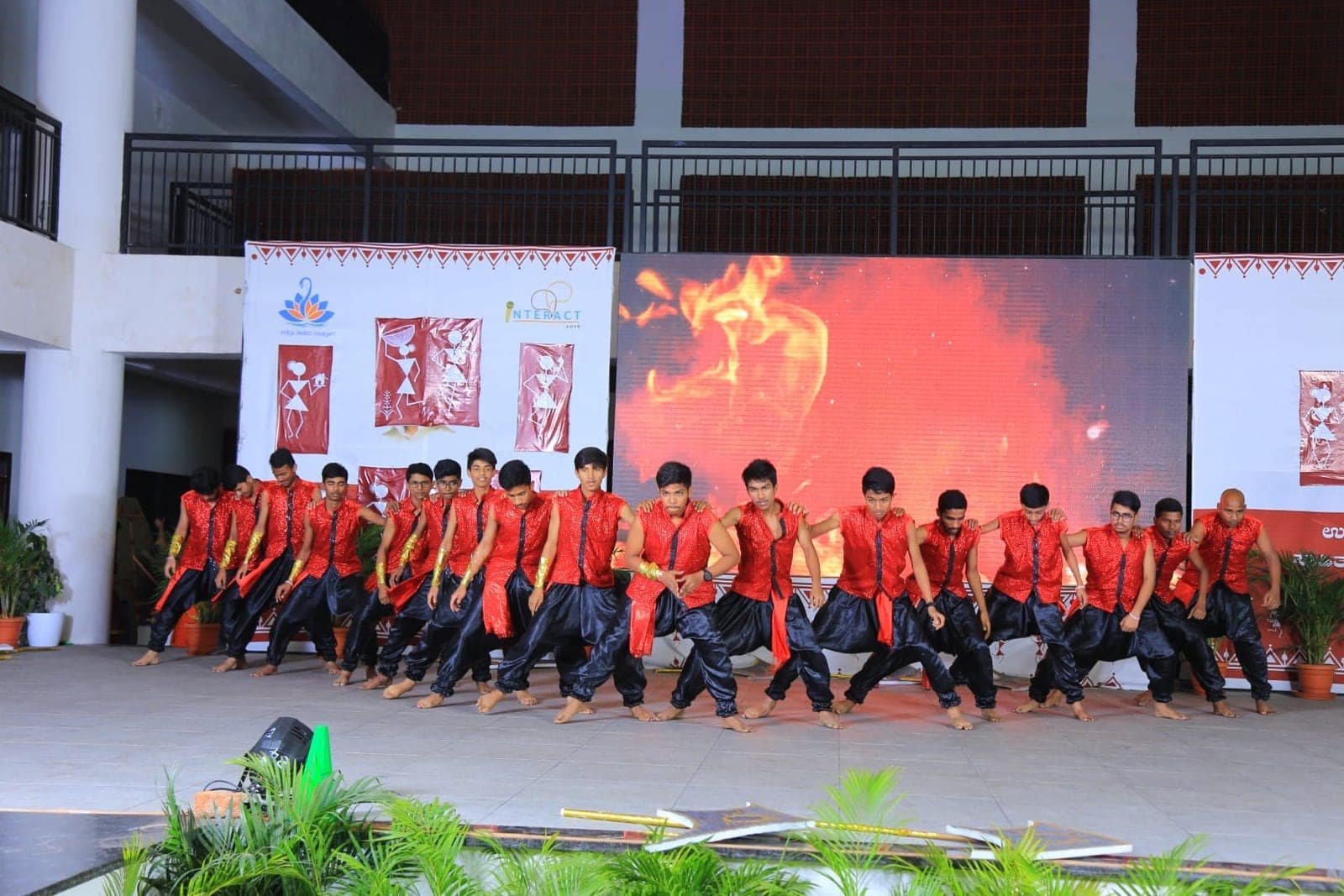 Fire dance performance on stage at Sri Sharada International School