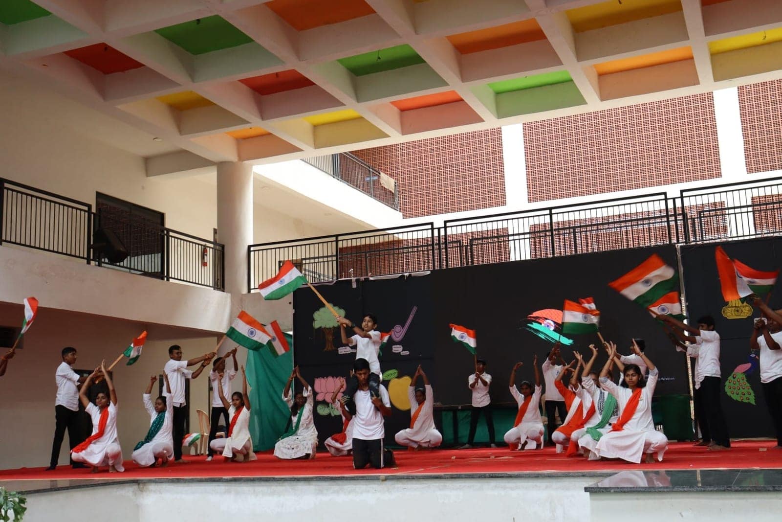 Tricolor dance performance on stage at Sri Sharada International School