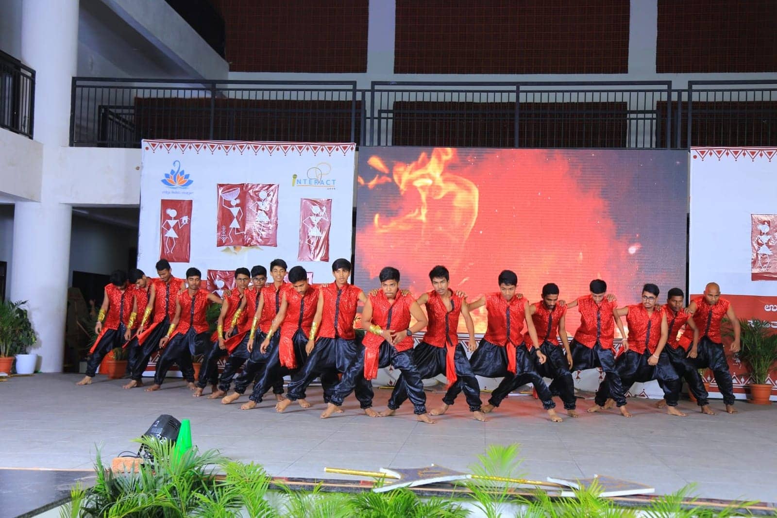 Fire dance performance on stage at Sri Sharada International School